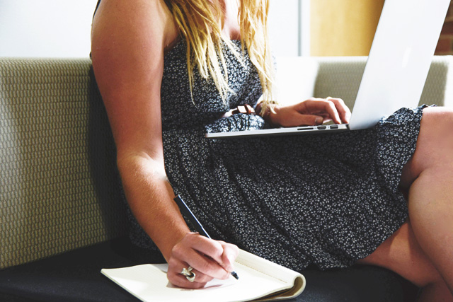 Photo: Woman taking notes