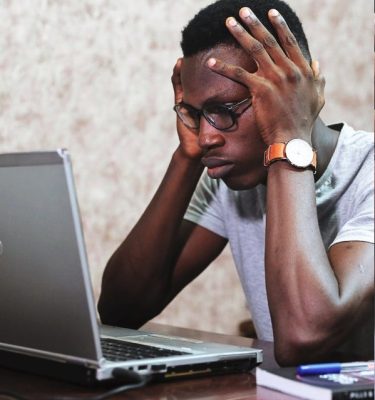 Man's laptop in trouble.